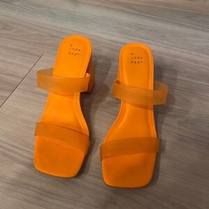 Neon orange block heels